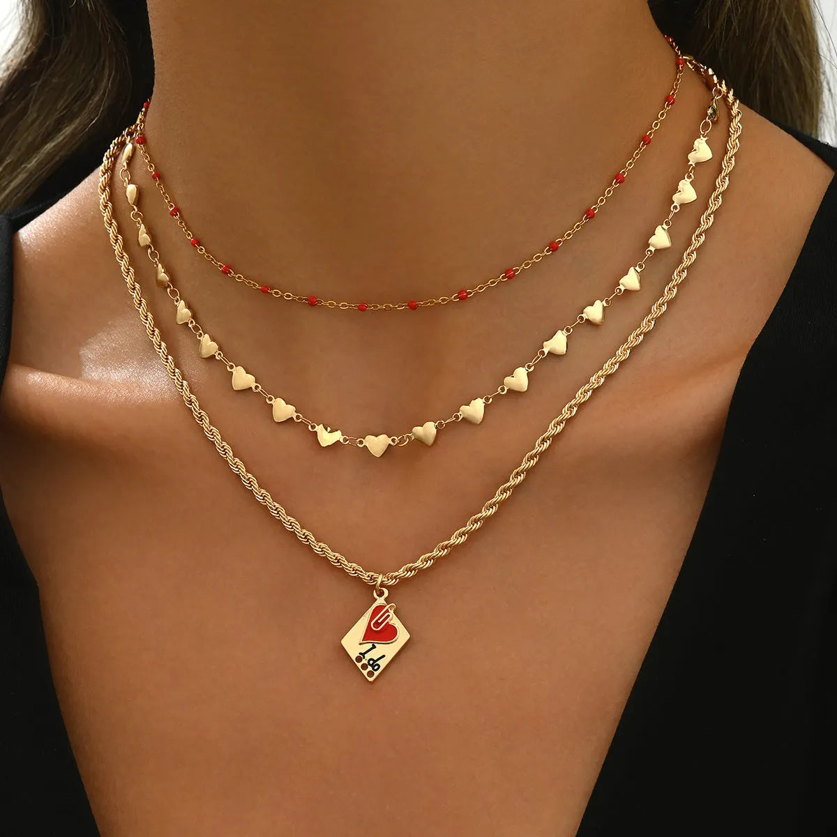 Three-layer clavicle necklace with geometric heart pendants on adjustable chain