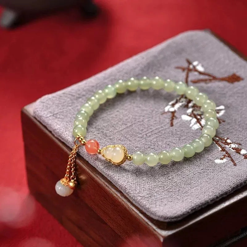 Qingshui jade women's bracelet with gold plated 6mm beads and Chinese fu character