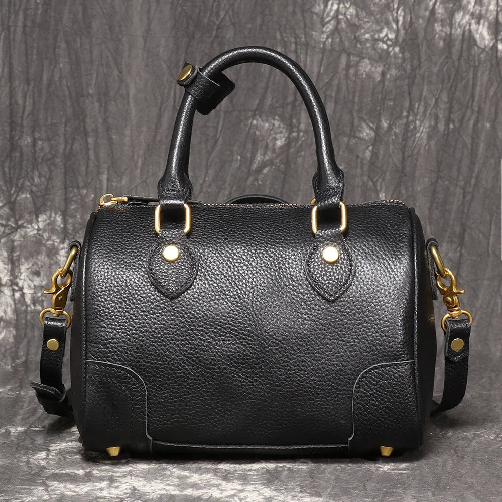 Brown yellow first layer cowhide Boston bag with cylindrical shape and single shoulder strap