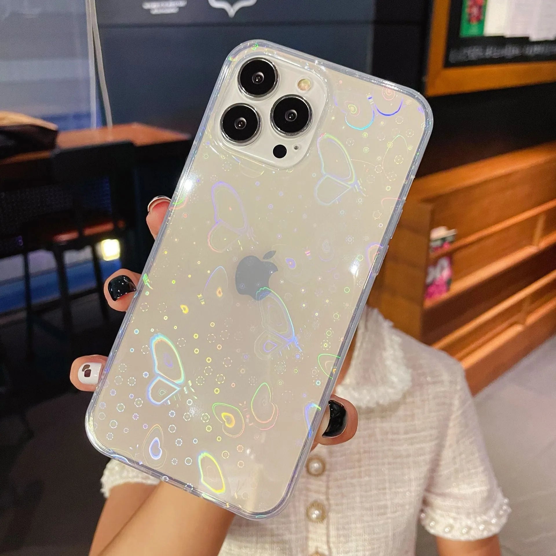 Transparent silicone iPhone case with laser colourful love heart design on the back.
