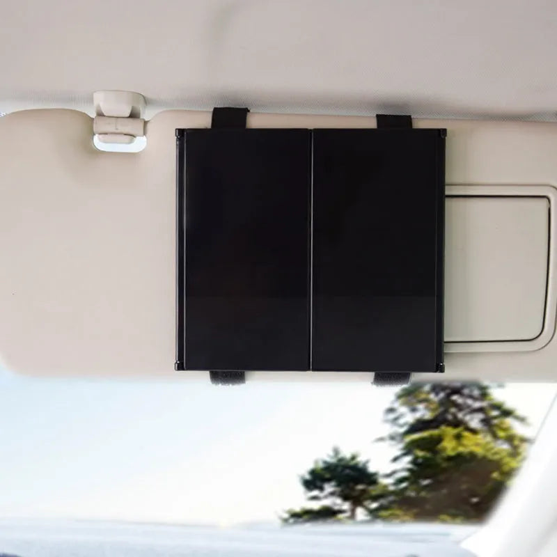 Silver folding car visor mirror shown closed and opened on a car sun visor.