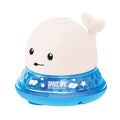 Floating grey and white whale bath toy spraying water with LED lights