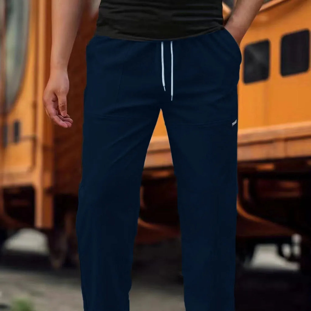 Men's light grey polyester trousers for spring and autumn casual wear, laid flat.