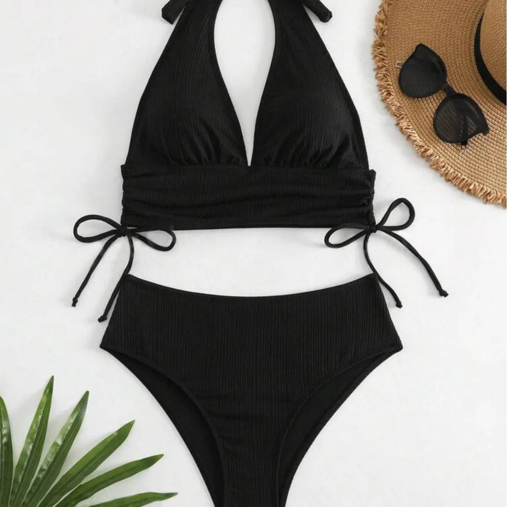 Women's black lace-up halter bikini set with briefs on mannequin