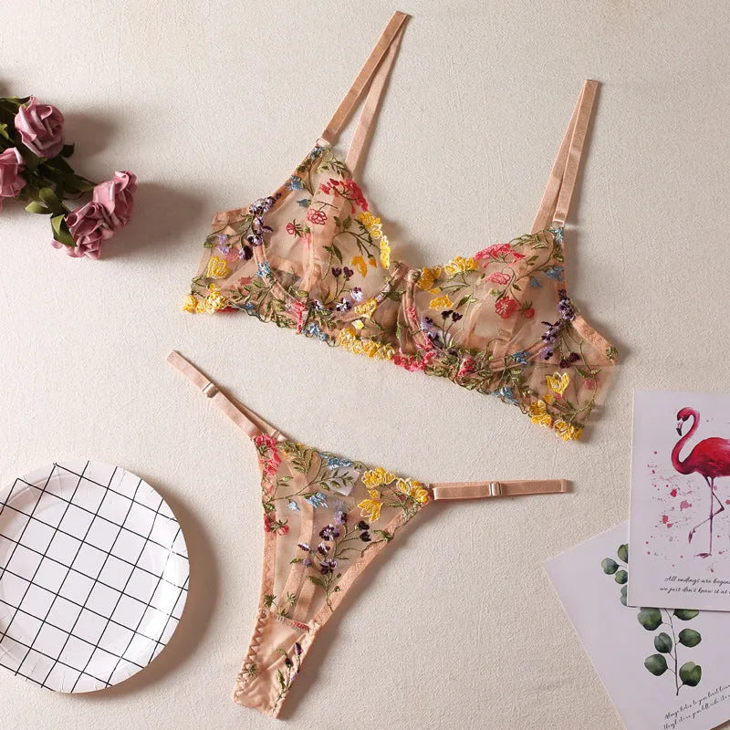 Floral patterned mesh bra with steel ring and matching T-back briefs in a choice of colours.