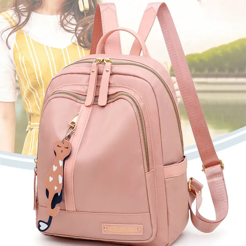 Soft black nylon women's casual backpack with double straps, external pocket, and internal organisers.