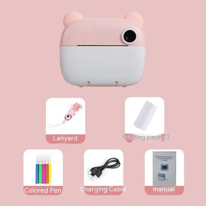 Pink children's printing camera with HD dual lenses, lanyard, and crayons on white background