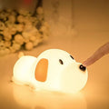 Silicone cartoon dog night light with two-tone design, shown with USB charging cable.