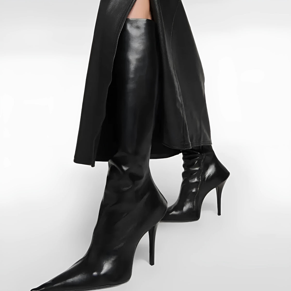 Black women's knee-high stiletto boots with pointed toe, side zipper, artificial PU upper, and rubber sole