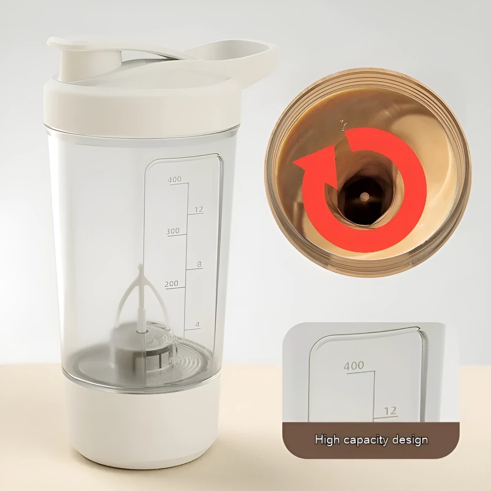 400ml electric protein shaker bottle in black with white lid and USB charging cable on a grey surface