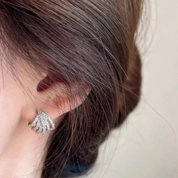 A pair of geometric line design drop earrings with a platinum colour finish.