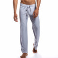 Silky loose mid-waist home trousers in grey on a model, showing relaxed fit for yoga or lounging