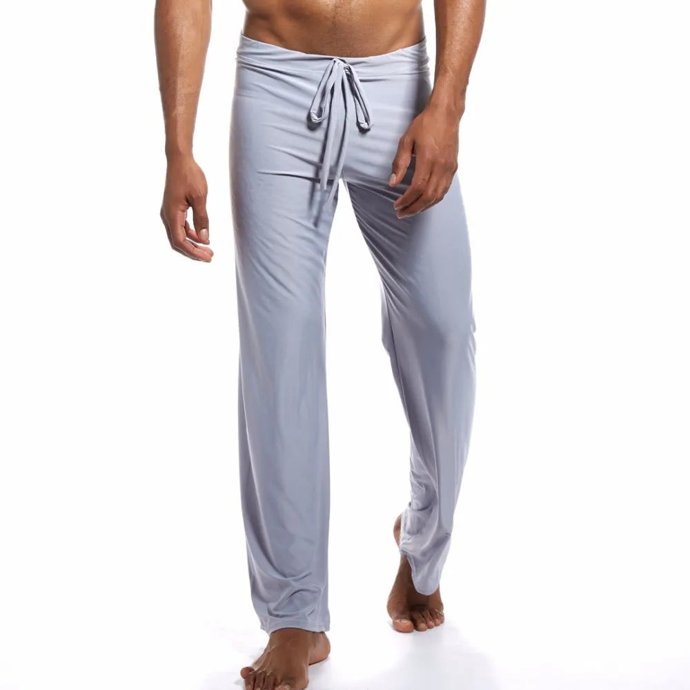 Silky loose mid-waist home trousers in grey on a model, showing relaxed fit for yoga or lounging