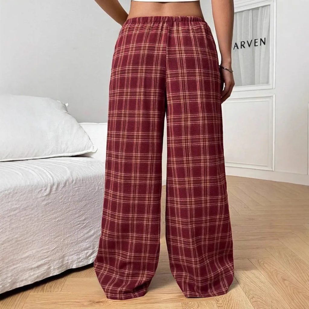 Women's red casual loose trousers with drawstring waist and plaid pockets on mannequin