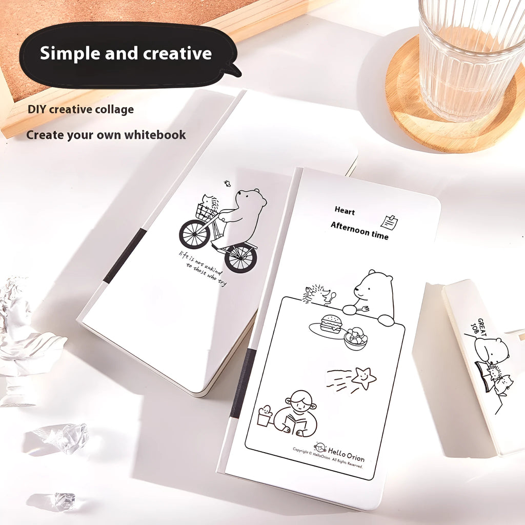 Small white paper notebook with plaid pages, mesh cover, and a pair of decorative stickers.