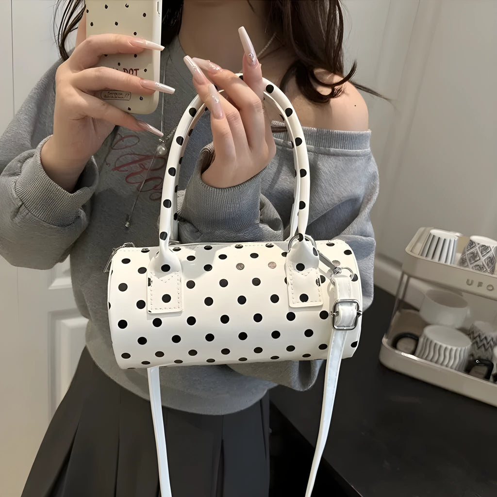 Korean-style PU leather tote pillow bag in black, white, and red colours, cylindrical shape with stitched seams and single shoulder strap, 20x10x10cm