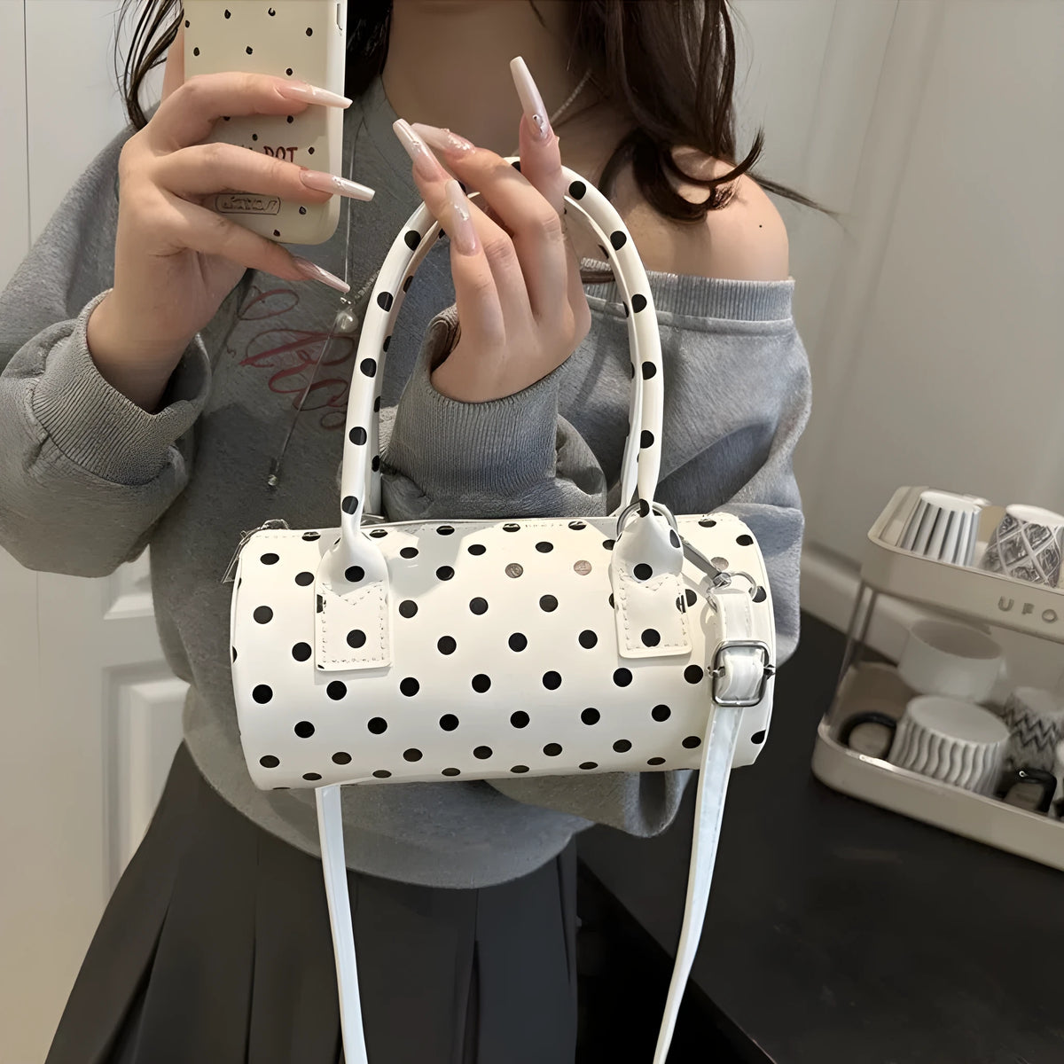 Korean-style PU leather tote pillow bag in black, white, and red colours, cylindrical shape with stitched seams and single shoulder strap, 20x10x10cm