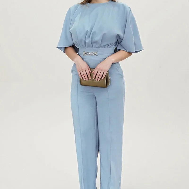 Blue men's two-piece polyester suit on a hanger, showing jacket and trousers.