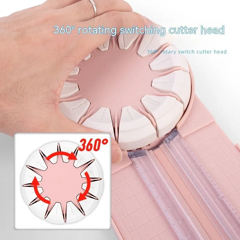 Pink 12-in-1 multifunctional paper cutting machine with dotted guide lines on its base.