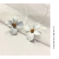 Flower-shaped stud earrings in pink and white colours with electroplated alloy construction