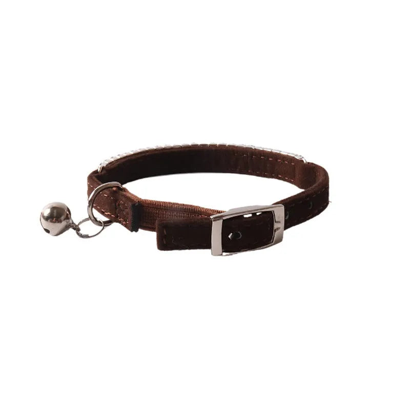 Soft flocked cat collar with elastic buckle in multiple colours on a white background.