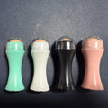 Volcanic stone portable oil absorbing facial roller in choice of colours on a white background.