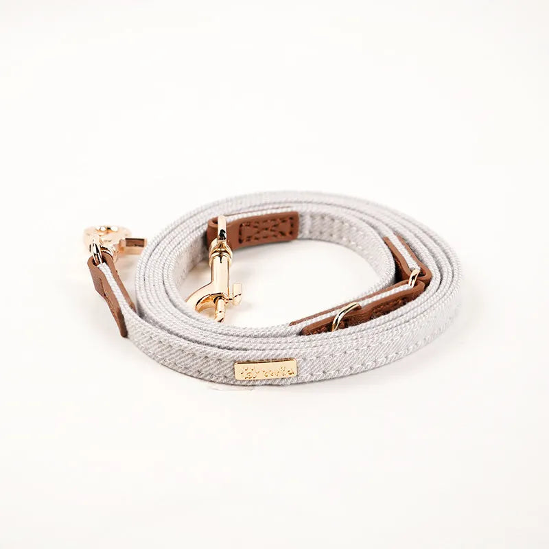 Anti-lost nameplate mohair dog collar in cement gray with matching hand holding rope for Shiba Inu