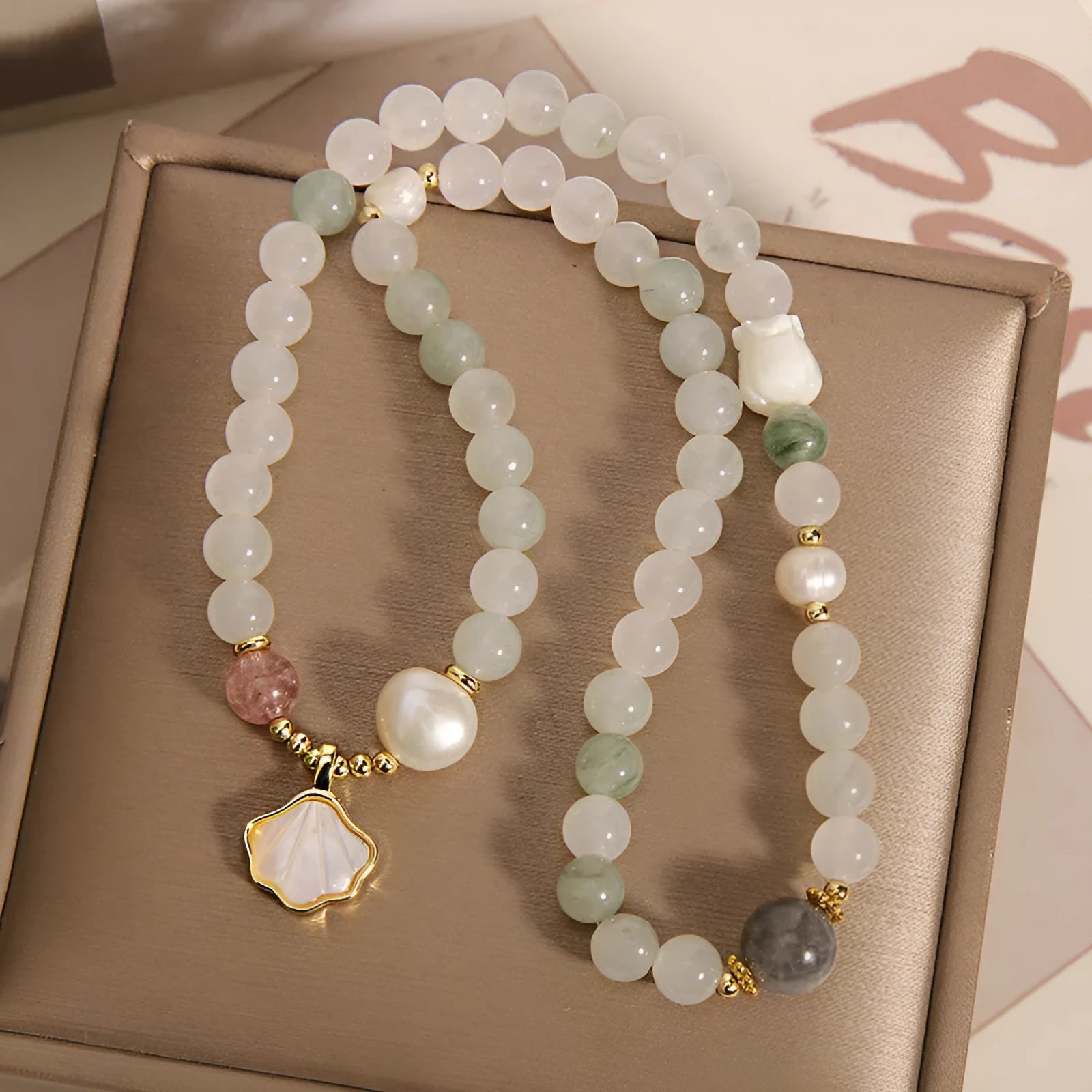 Women's crystal bracelet with artistic ginkgo leaf pendant and rhinestone accents