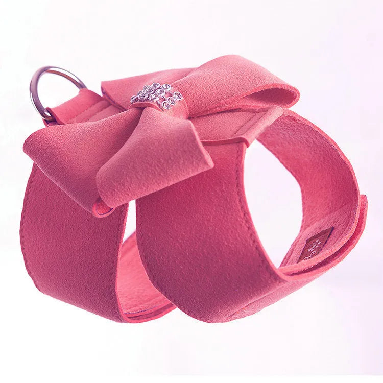 A pink microfiber dog harness with a decorative bowknot on the collar, sized for a small puppy.