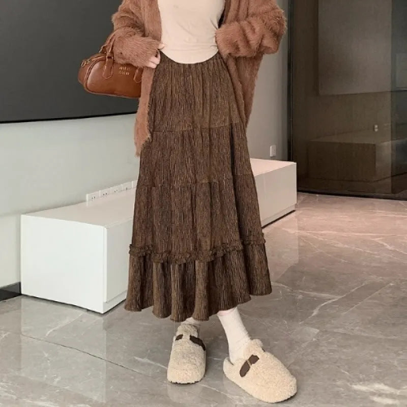 Women's solid colour corduroy A-line midi skirt with elastic waistband in milky white.