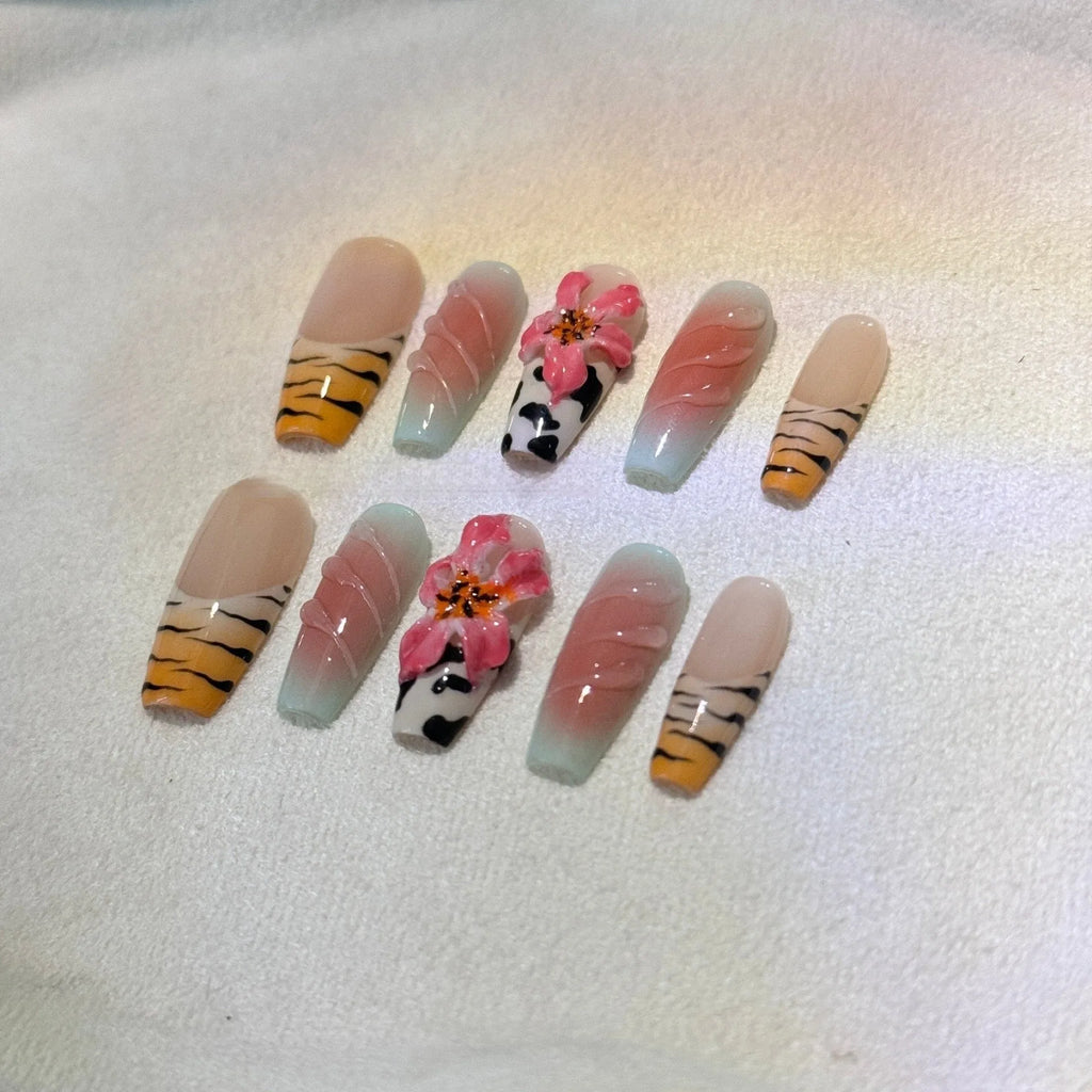 Zebra pattern lily hand carving nail art set showing embossed designs in multiple sizes
