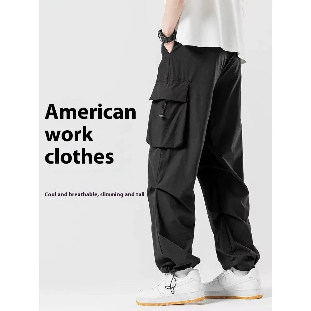 Men's loose straight cargo pants in black with wide-leg cut and drawstring waist