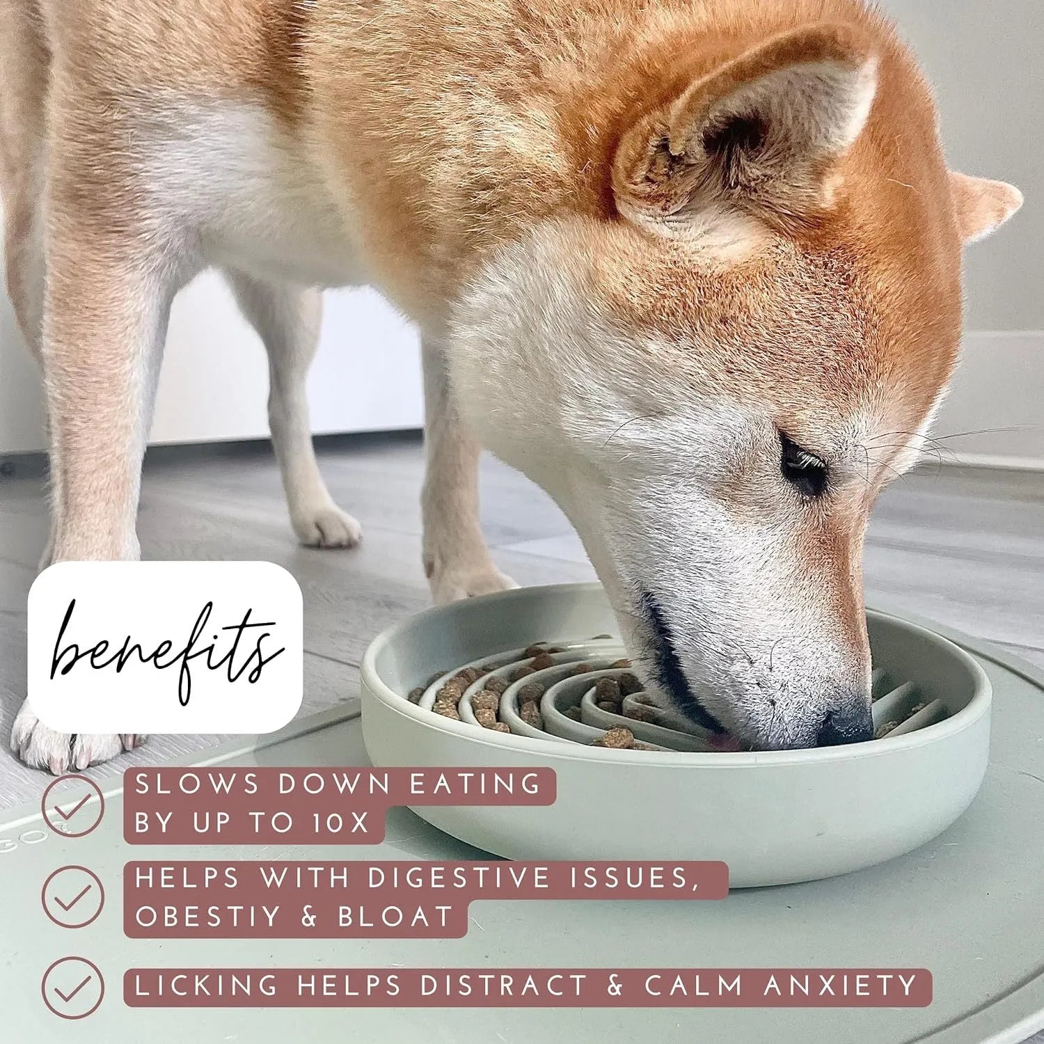 Silicone slow feeder dog bowl with ridges in various colours on a table.
