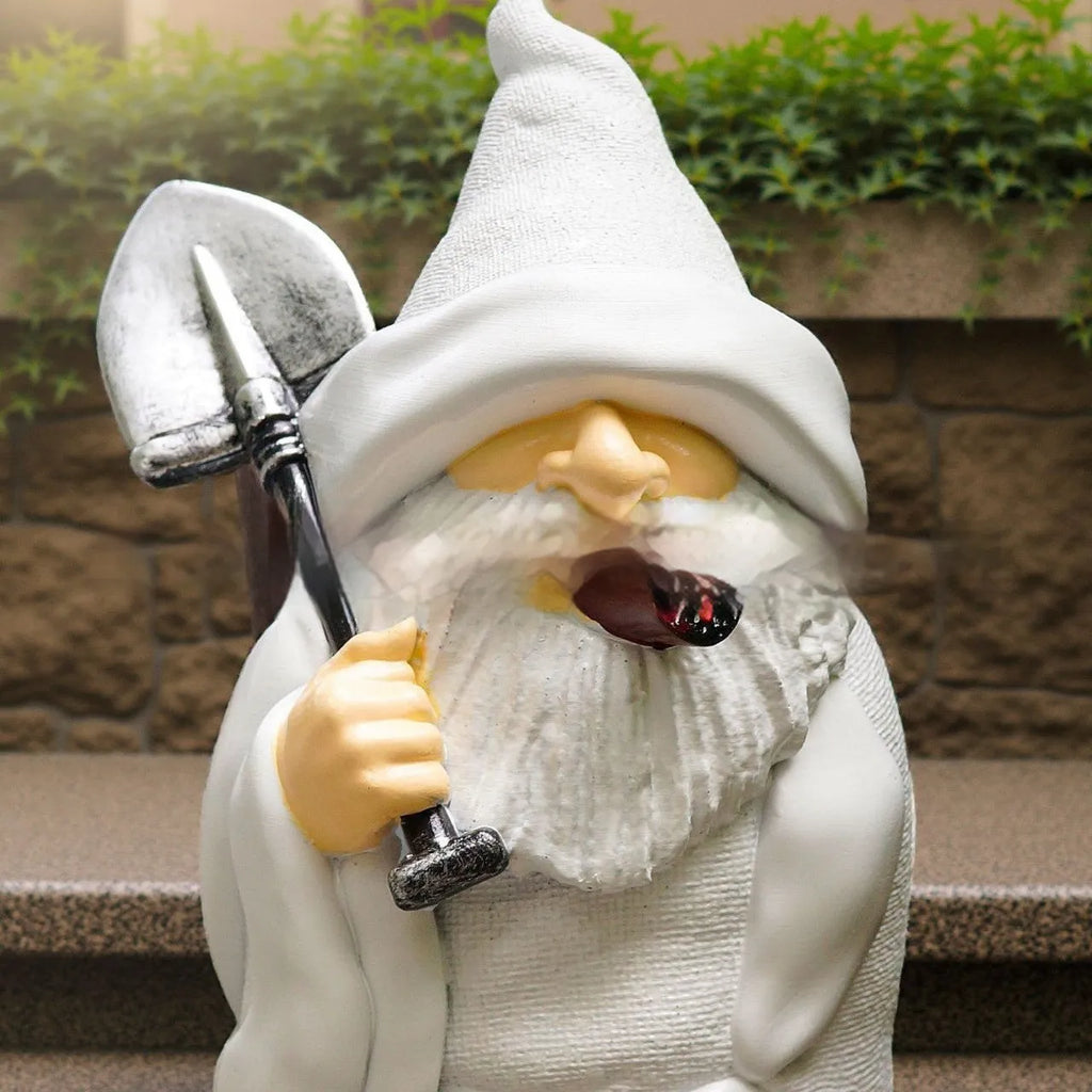 Christmas garden ornament showing dwarf character holding smoking shovel, resin craft figurine