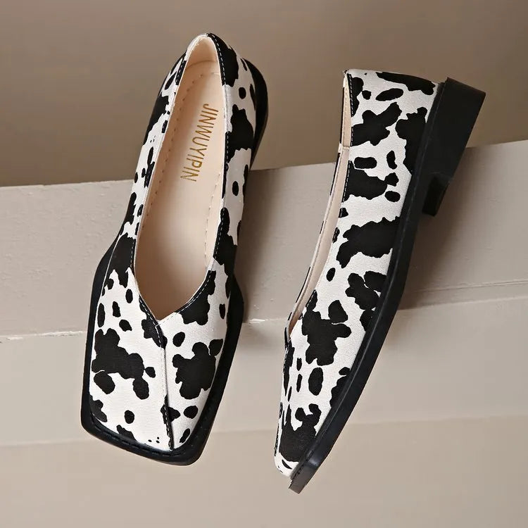Women's black and white cow pattern flat shoes in first layer cowhide with 6-8cm high heel and rubber sole