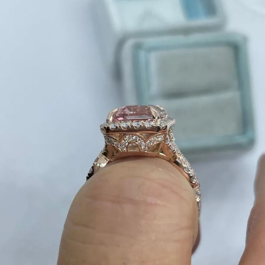 Rose gold coloured geometric alloy ring showing electroplated finish and angular design details