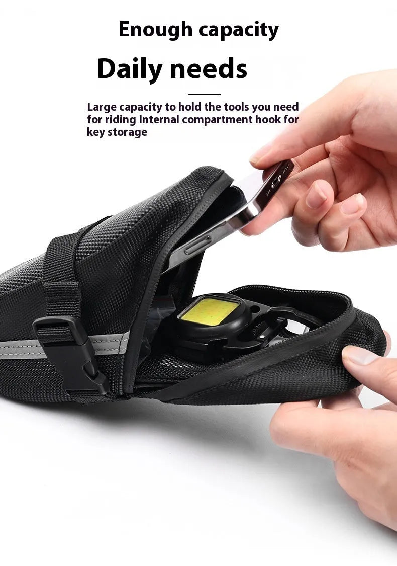 Black cycling tail bag with quick-release mounting for bicycle saddle
