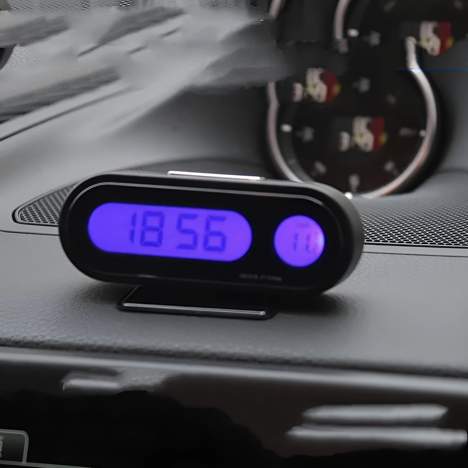 Black electronic car dashboard clock and thermometer with adjustable bracket on display