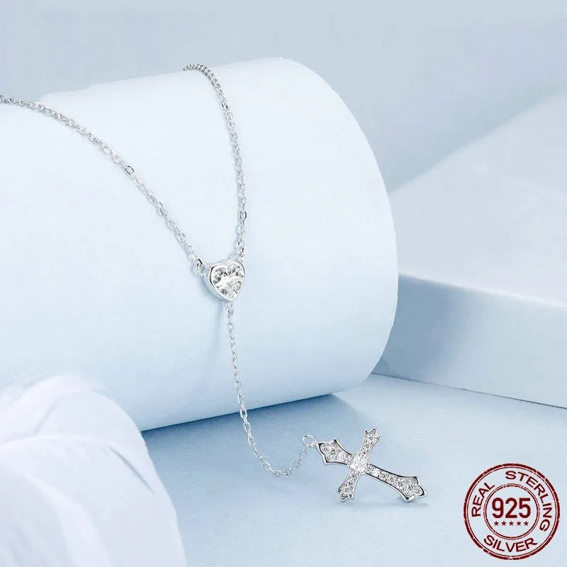 Silver cross necklace with O-ring chain in BSN384 colour, showing V-neck design