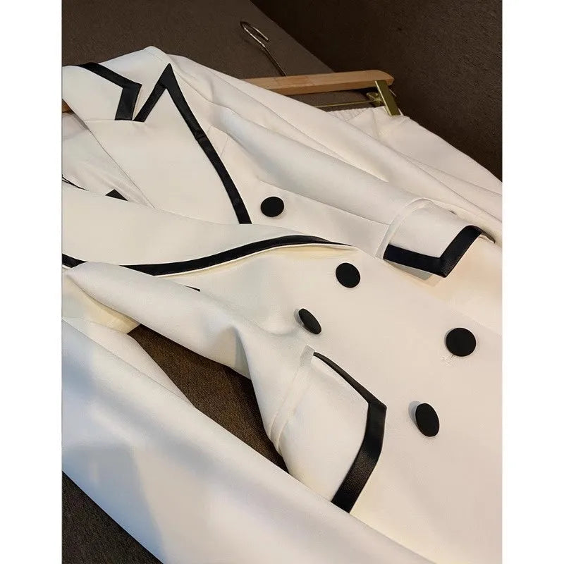 White polyester women's formal suit set with blazer top and matching trousers