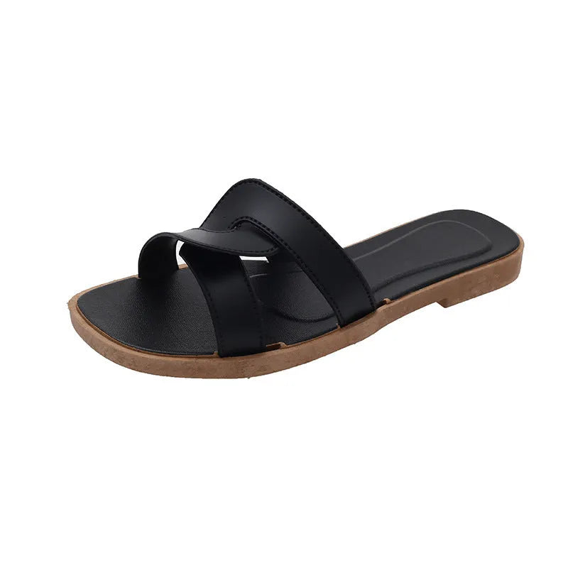 Women's cross strap PVC sandals in light blue, showing toe ring and non-slip sole.