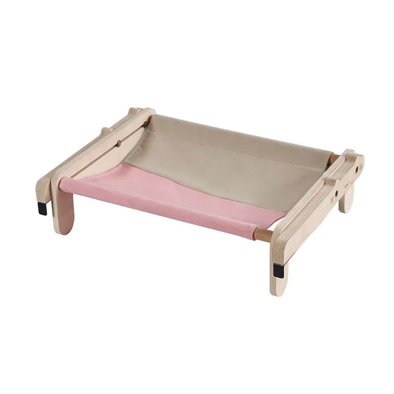 Solid wood cat bed with removable cushion in grey-toned seasonal pattern colours