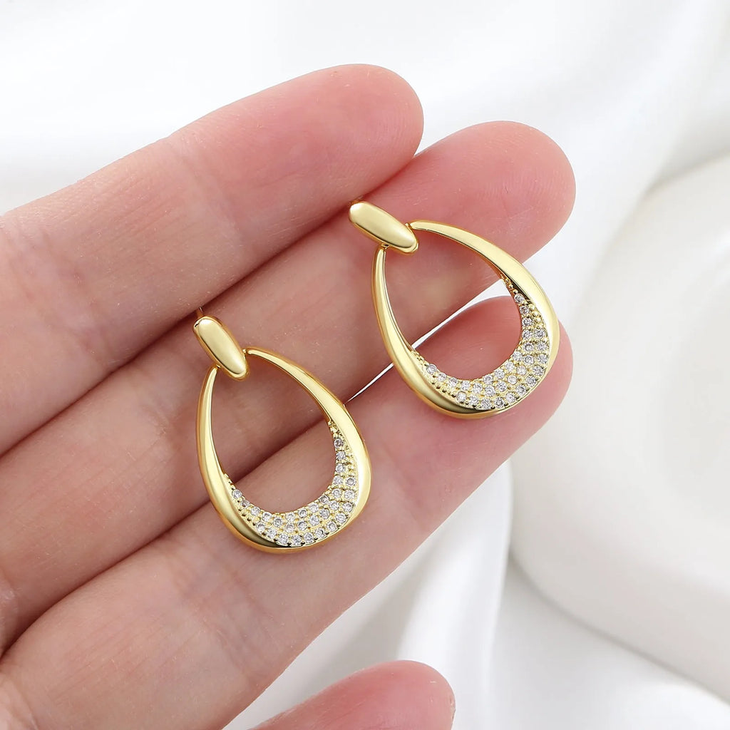 Yellow gold geometric drop earrings with zircon accents measuring 2.6cm x 1.7cm