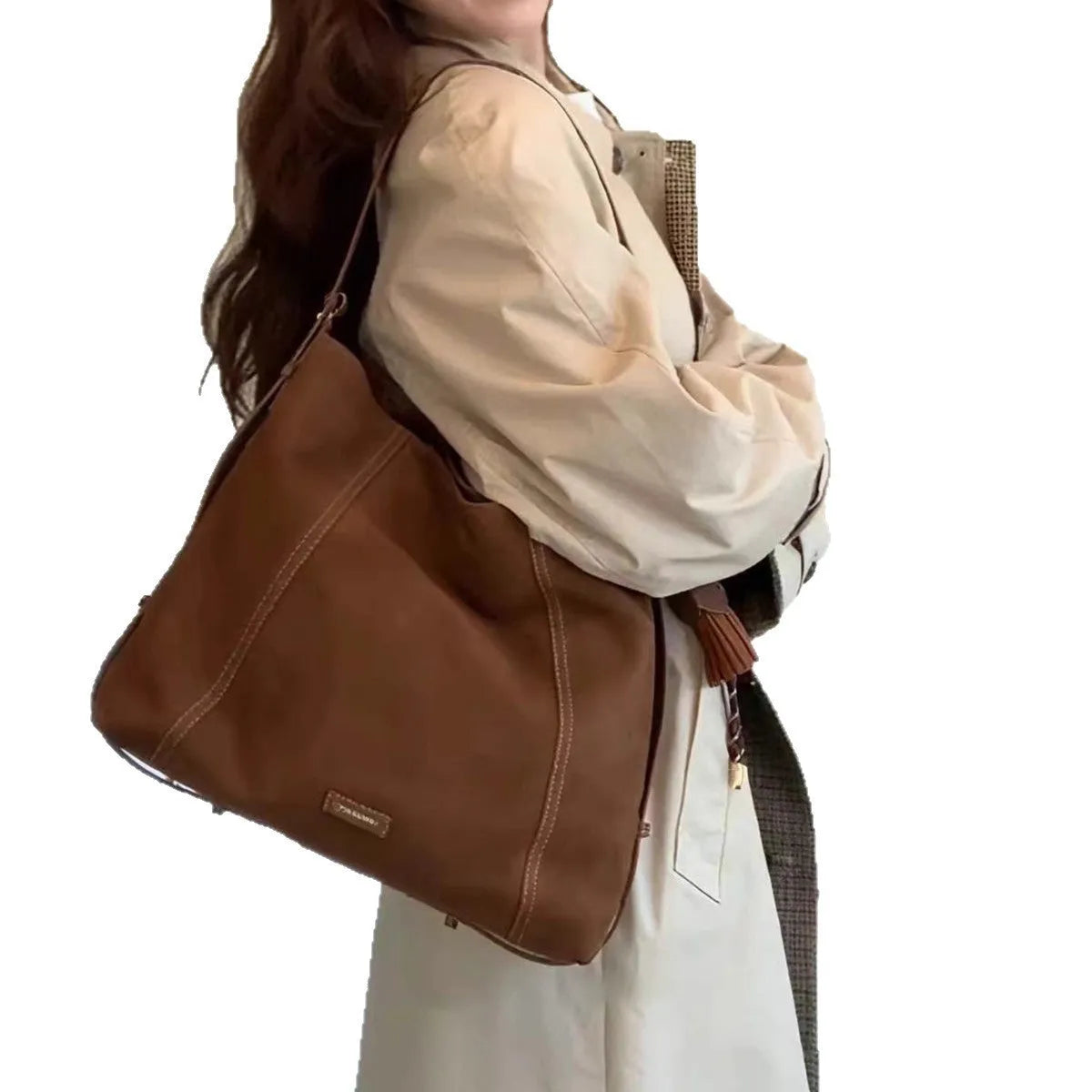 Large capacity coffee colour suede messenger bag with visible sewing line detail and single shoulder strap, shown on a plain background.