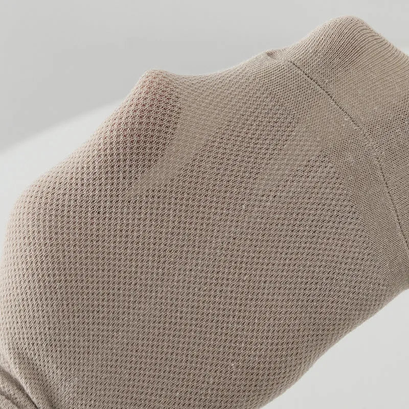 A pair of solid-colour, low-cut boat socks for men made from breathable polyester, shown in one of the six available shade options.
