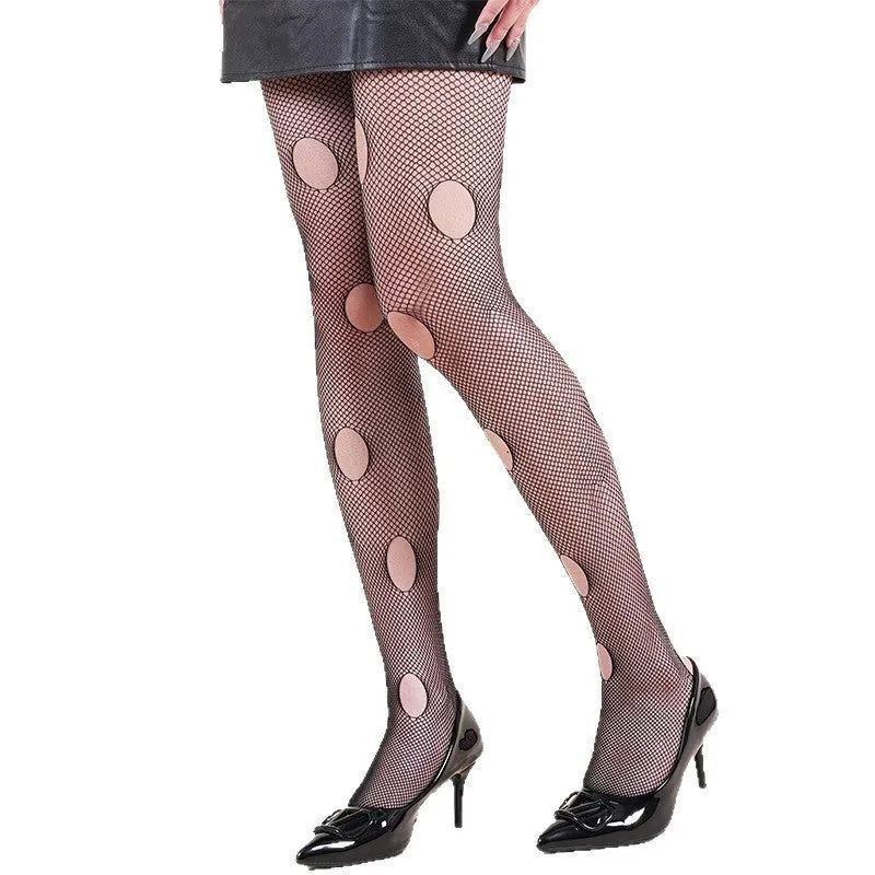 Halloween spider web leopard print fishnet stockings on women's legs, seamless black nylon with pattern