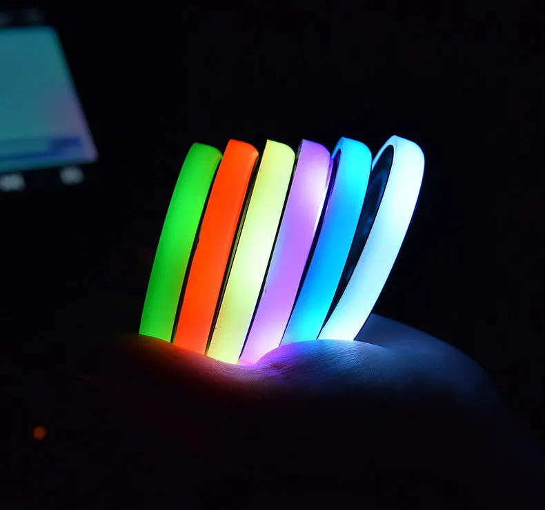 Colourful LED light-up coaster for a car cup holder showing multiple light colours on a 68mm acrylic and ABS mat.