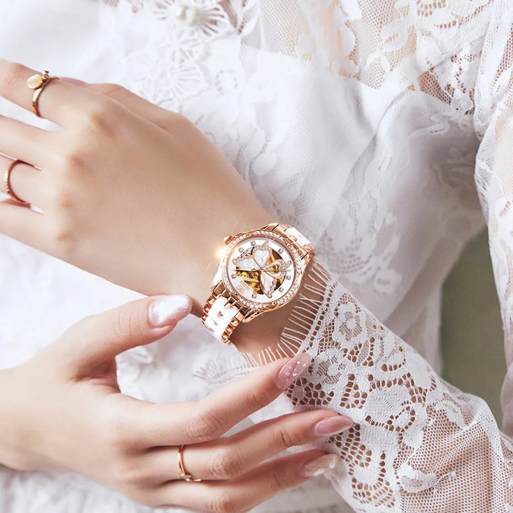 Ladies automatic mechanical watch gift box set with luminous digital display, 35mm dial, and flat top tapered crown on a white rose shell design.