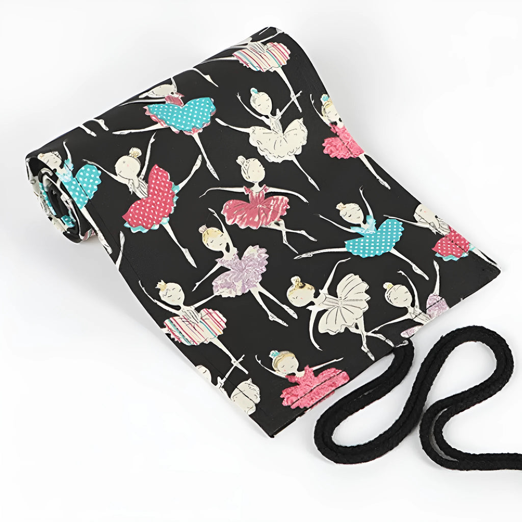 Canvas rolling pencil case with ballet girl print, showing multiple pencils organised in holes.