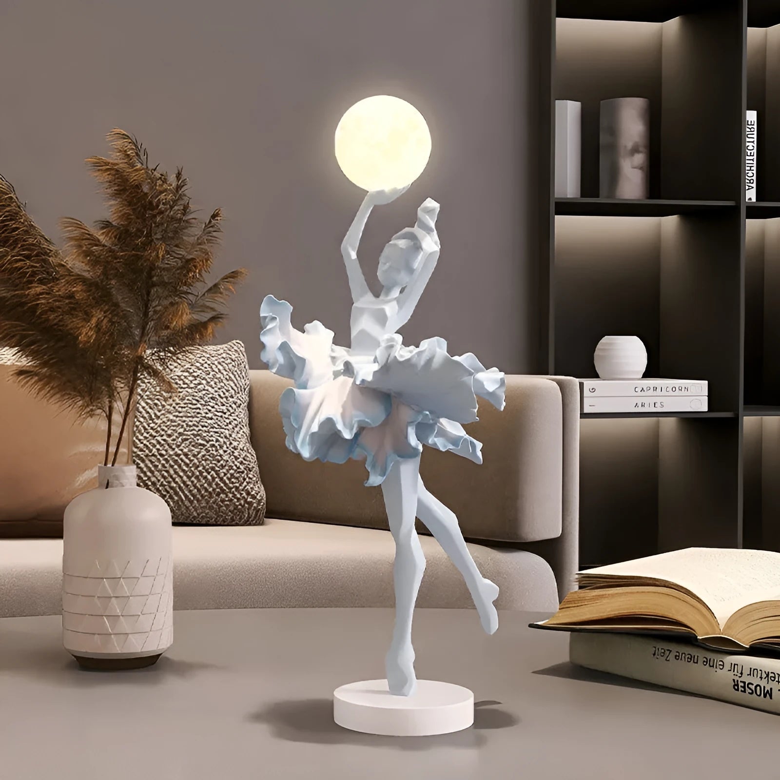Small modern resin night lamp in black gold colour with USB charging cable.